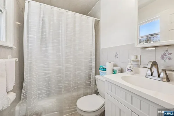 a bed room with a bed and a chair