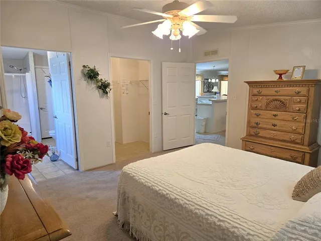 a bathroom with a granite countertop sink a toilet and shower