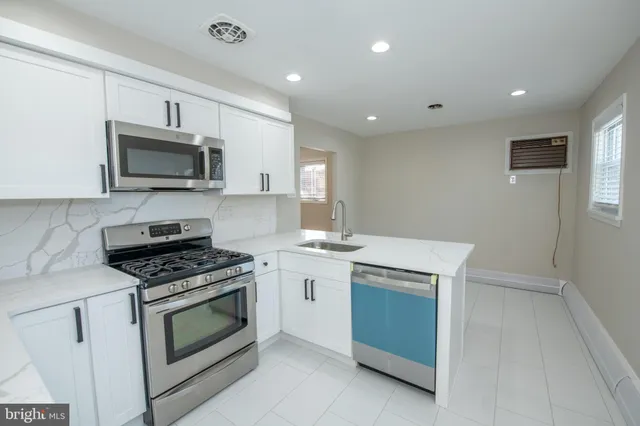 a kitchen with a stove and a microwave