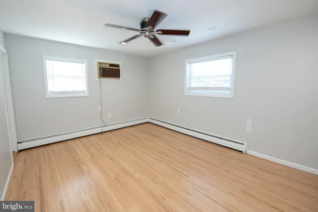 a bathroom with a sink a toilet and shower curtain