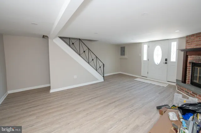 a view of storage and utility room with wooden floor
