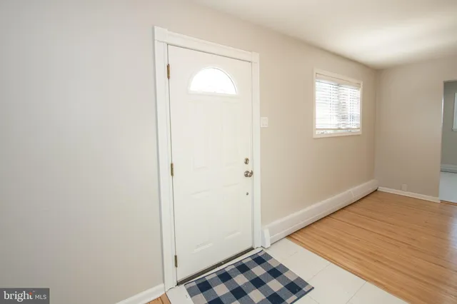 a view of a room with wooden floor and closet
