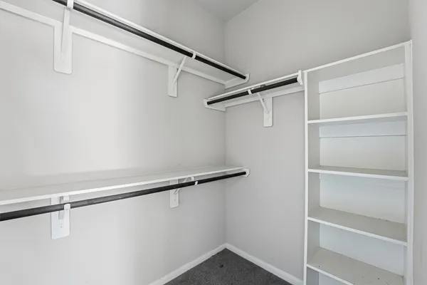 a view of an empty walk in closet