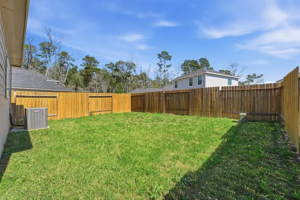 a view of a backyard with a garden and plants