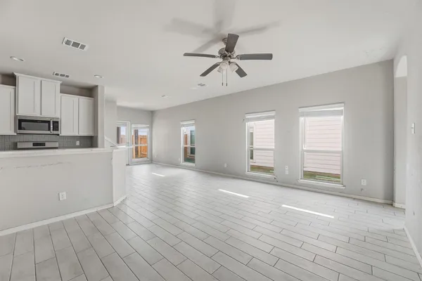 a view of a kitchen with microwave and cabinets