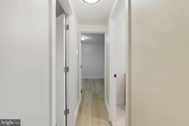 a view of a bathroom from a hallway