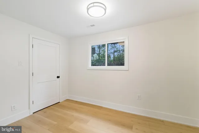 an empty room with a empty space and a window