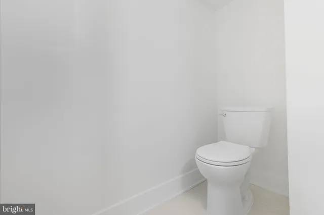 a bathroom with a toilet and a sink