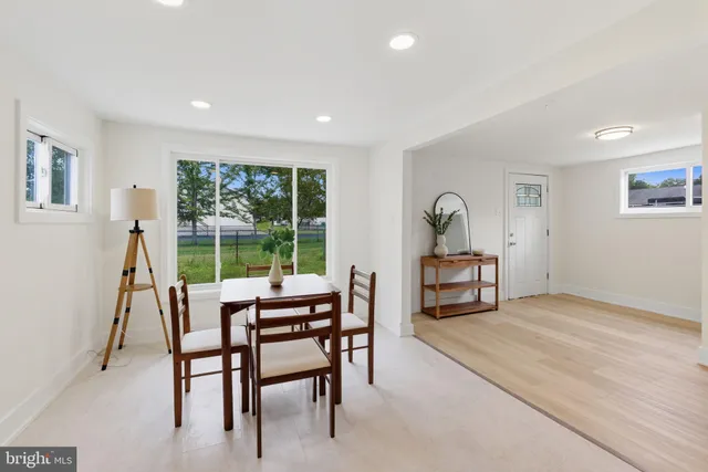 a dining room with furniture and window