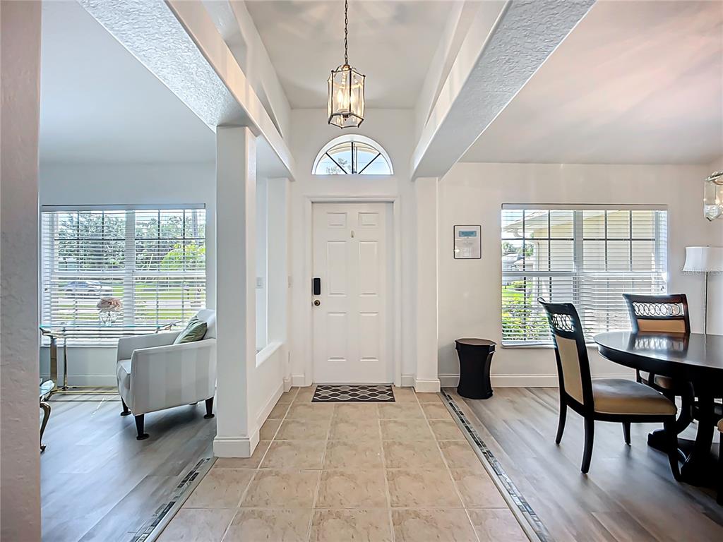 123 Marker Road Rotonda West, FL 33947 - Photo 13 of 66 a view of a livingroom with furniture window and wooden floor