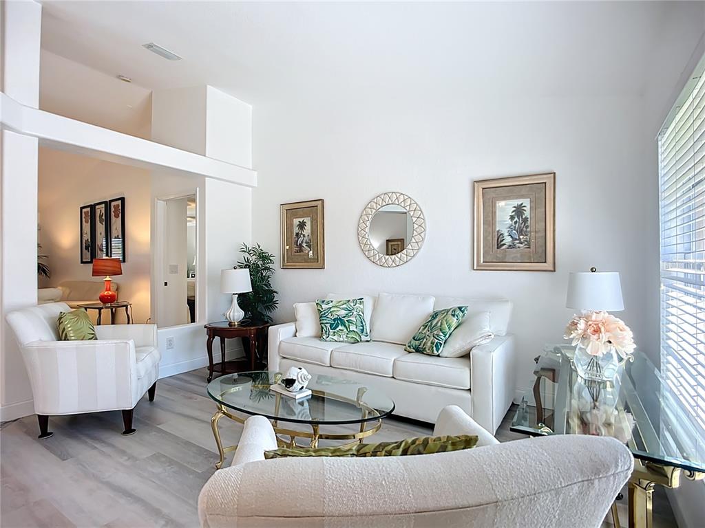 123 Marker Road Rotonda West, FL 33947 - Photo 16 of 66 a living room with furniture and wooden floor