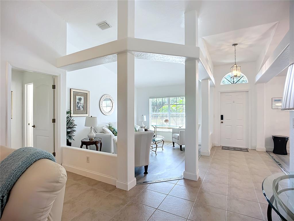 123 Marker Road Rotonda West, FL 33947 - Photo 20 of 66 a living room with furniture and a large window