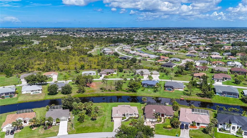 123 Marker Road Rotonda West, FL 33947 - Photo 2 of 66 an aerial view of residential houses with outdoor space