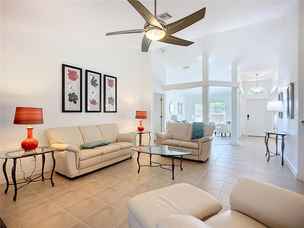 123 Marker Road Rotonda West, FL 33947 - Photo 22 of 66 a living room with furniture and a large window