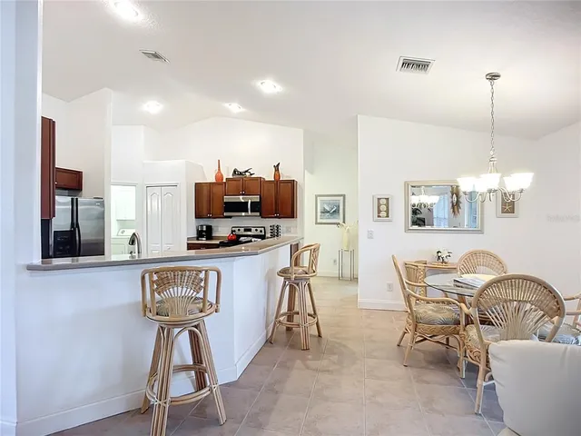 a kitchen with stainless steel appliances a sink stove and refrigerator