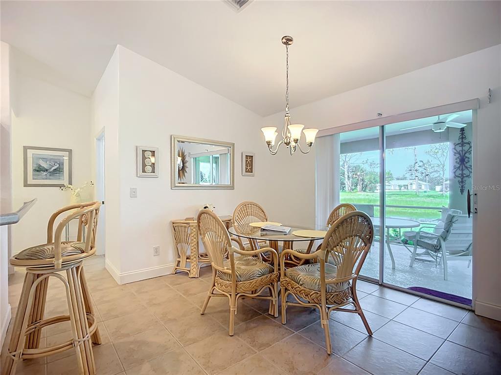 123 Marker Road Rotonda West, FL 33947 - Photo 25 of 66 a view of a dining room with furniture window and outside view