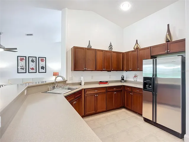 a kitchen with stainless steel appliances a stove and cabinets