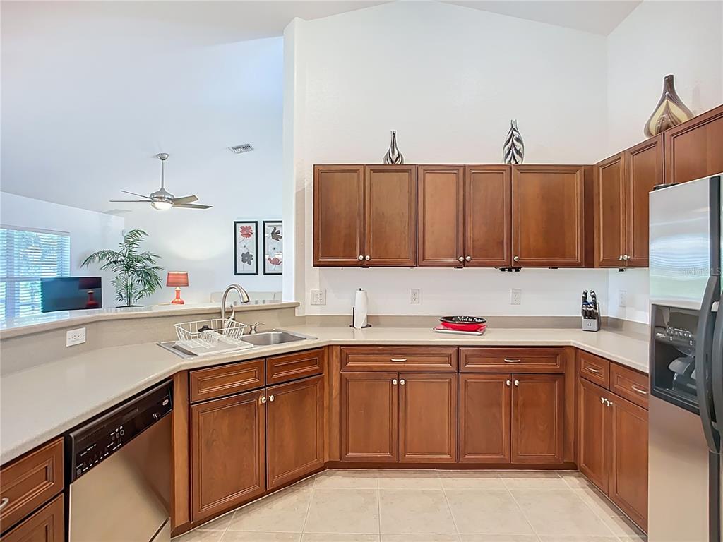 123 Marker Road Rotonda West, FL 33947 - Photo 29 of 66 a kitchen with a sink and cabinets