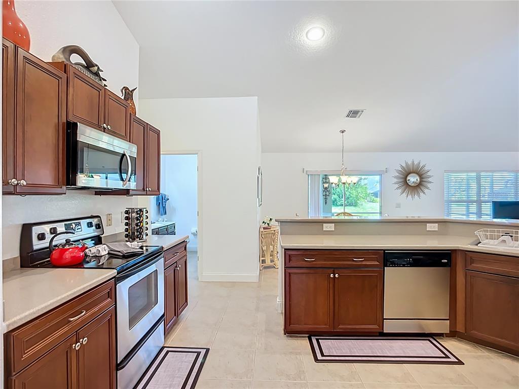 123 Marker Road Rotonda West, FL 33947 - Photo 31 of 66 a kitchen with a sink and cabinets