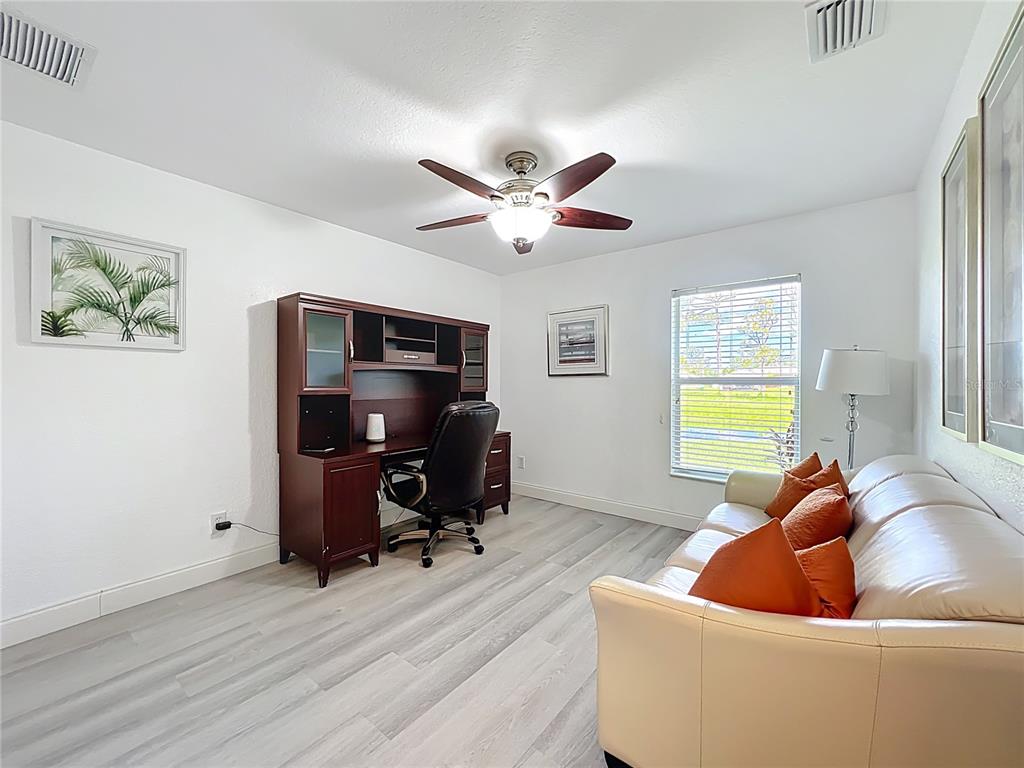 123 Marker Road Rotonda West, FL 33947 - Photo 33 of 66 a living room with furniture and a window