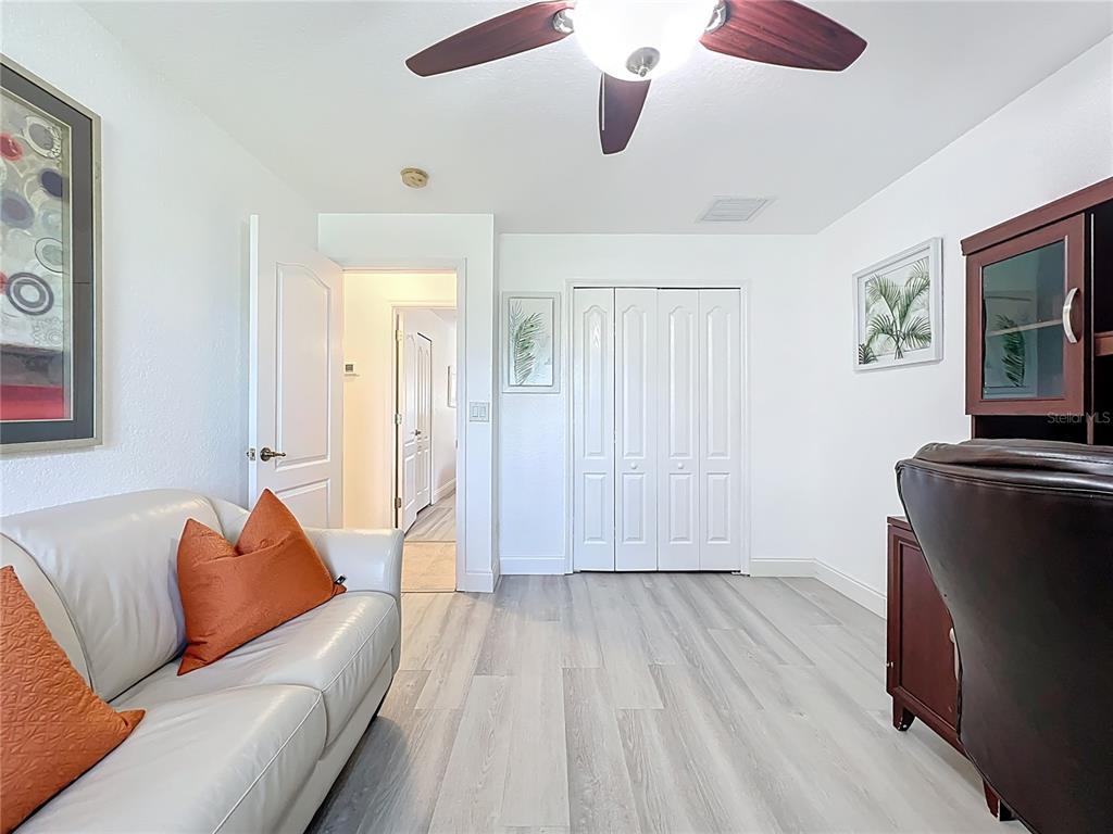 123 Marker Road Rotonda West, FL 33947 - Photo 35 of 66 a living room with furniture and a flat screen tv
