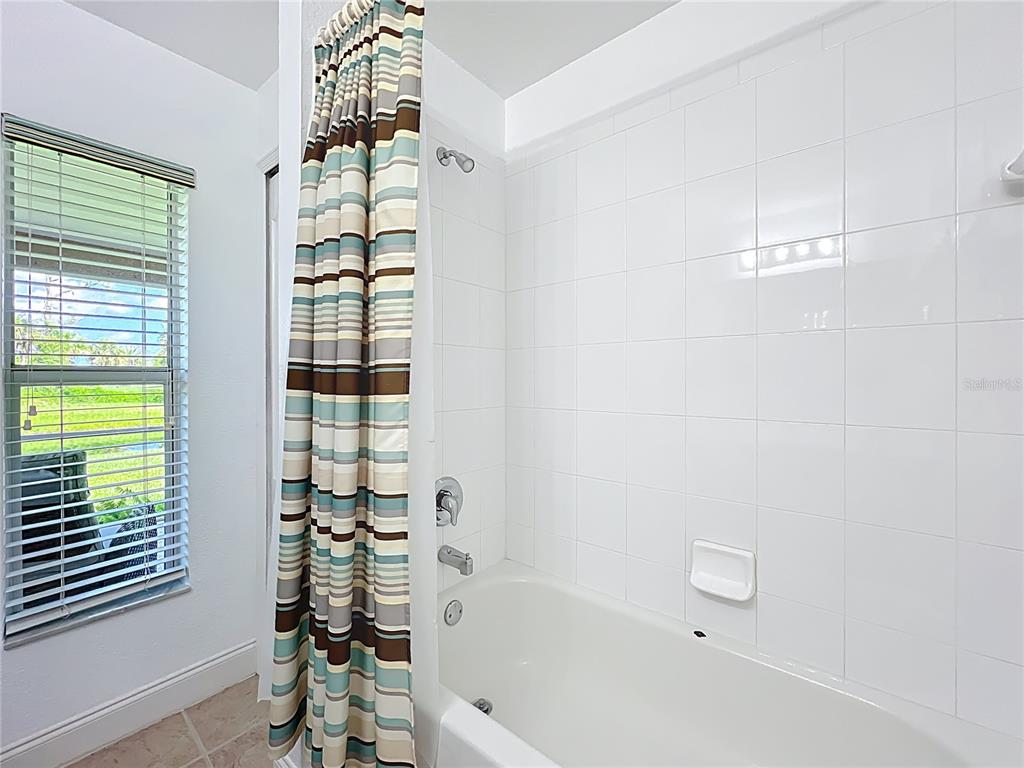 123 Marker Road Rotonda West, FL 33947 - Photo 37 of 66 a bathroom with a bathtub and shower
