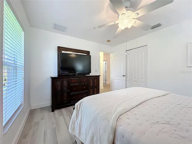 a white bath tub sitting next to a white toilet