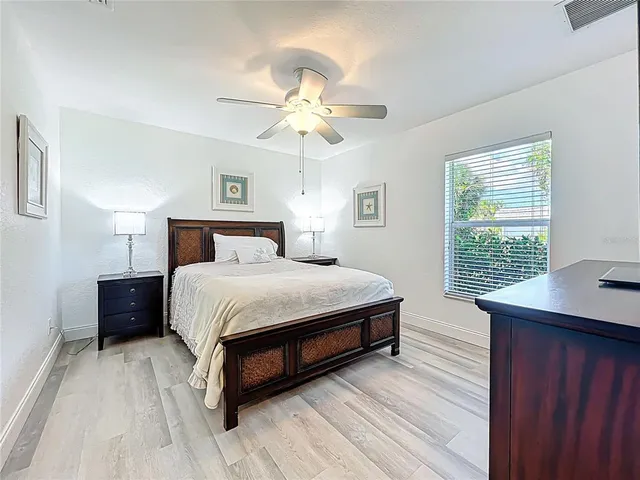 a spacious bathroom with a sink mirror and a shower