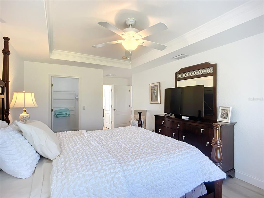 123 Marker Road Rotonda West, FL 33947 - Photo 40 of 66 a bedroom with a bed and a flat screen tv