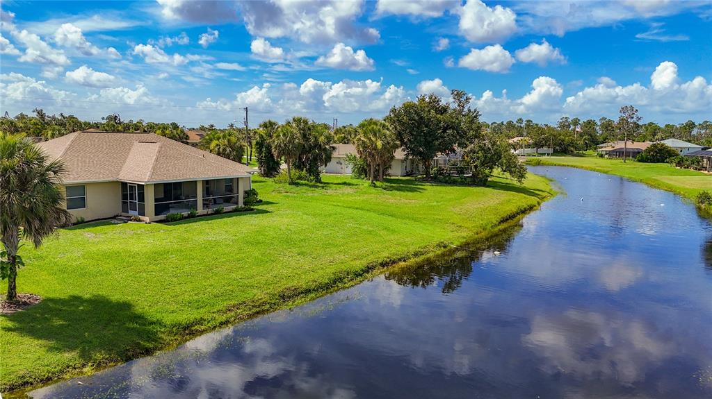 123 Marker Road Rotonda West, FL 33947 - Photo 57 of 66 a view of a house with a yard