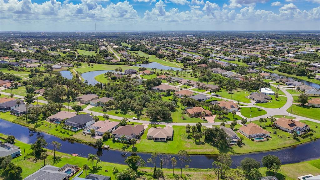 123 Marker Road Rotonda West, FL 33947 - Photo 64 of 66 an aerial view of residential houses with outdoor space