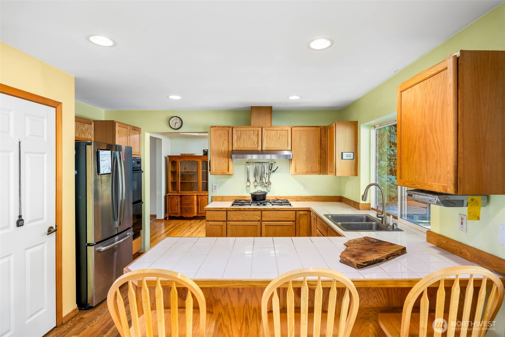 24165 Port Gamble Road Northeast Poulsbo, WA 98370 - Photo 14 of 37 a view of a dining room with furniture