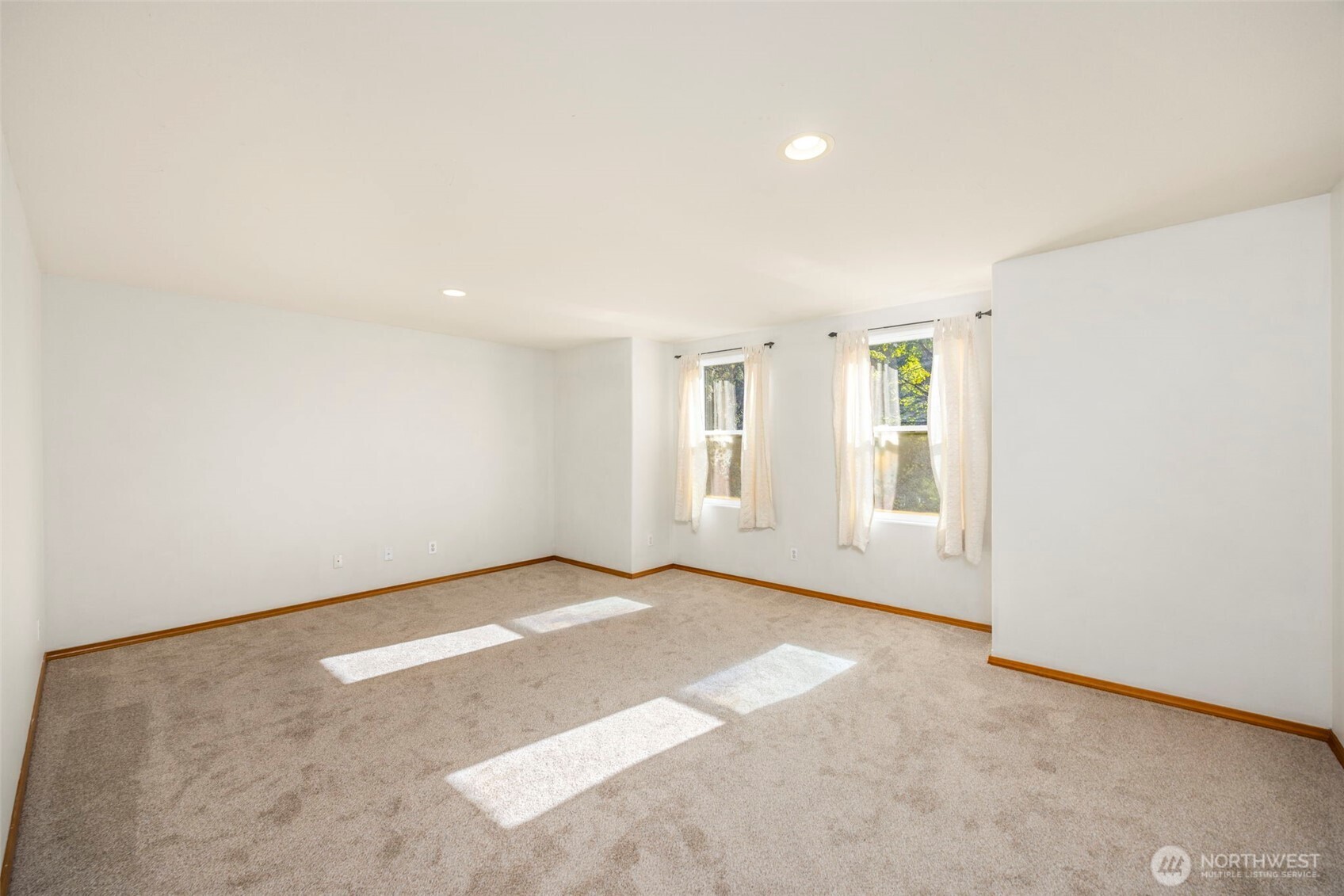 24165 Port Gamble Road Northeast Poulsbo, WA 98370 - Photo 22 of 37 an empty room with windows