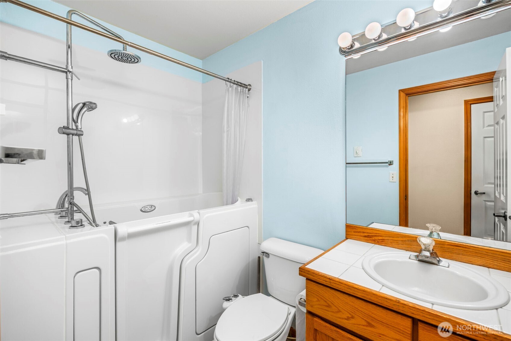24165 Port Gamble Road Northeast Poulsbo, WA 98370 - Photo 25 of 37 a bathroom with a sink vanity mirror and toilet