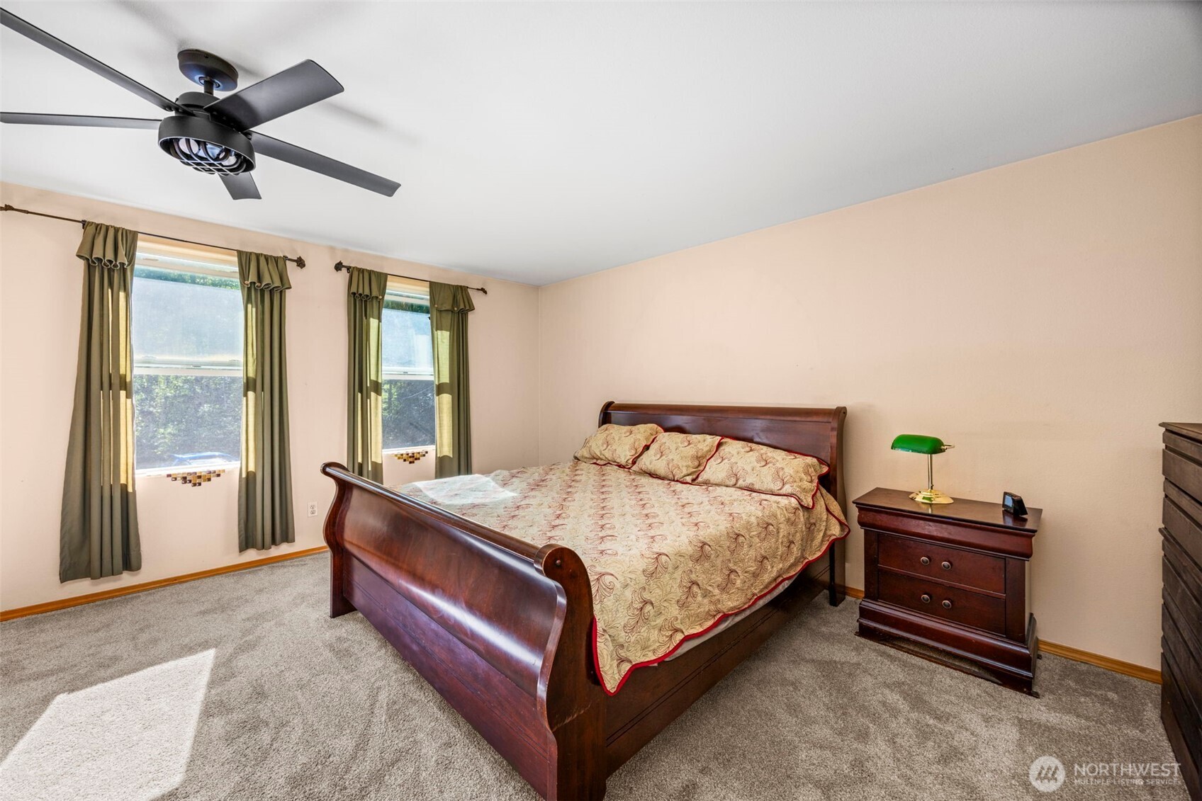 24165 Port Gamble Road Northeast Poulsbo, WA 98370 - Photo 26 of 37 a bed sitting in a spacious bedroom next to a window