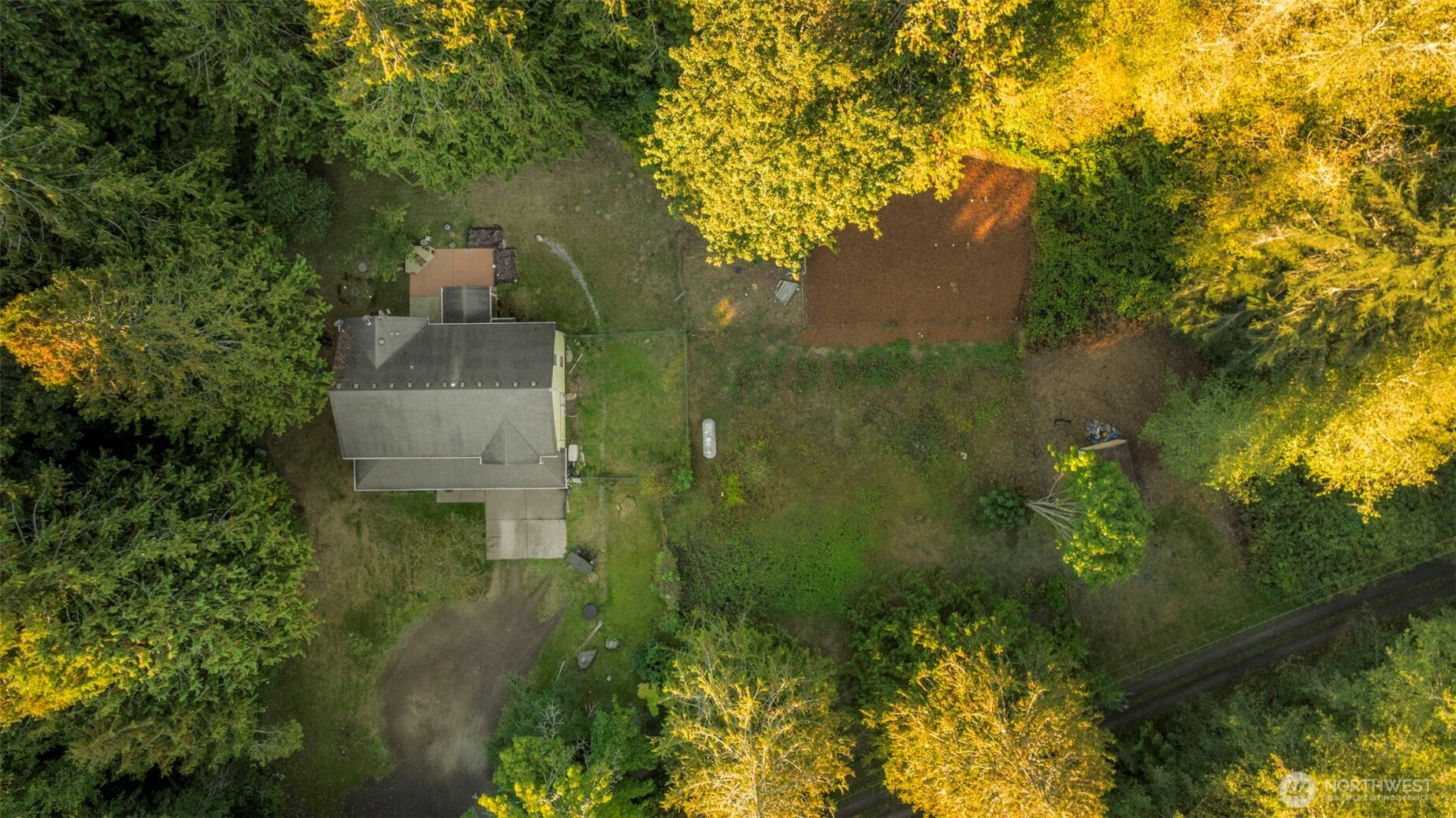 24165 Port Gamble Road Northeast Poulsbo, WA 98370 - Photo 36 of 37 a view of a garden from a lake view