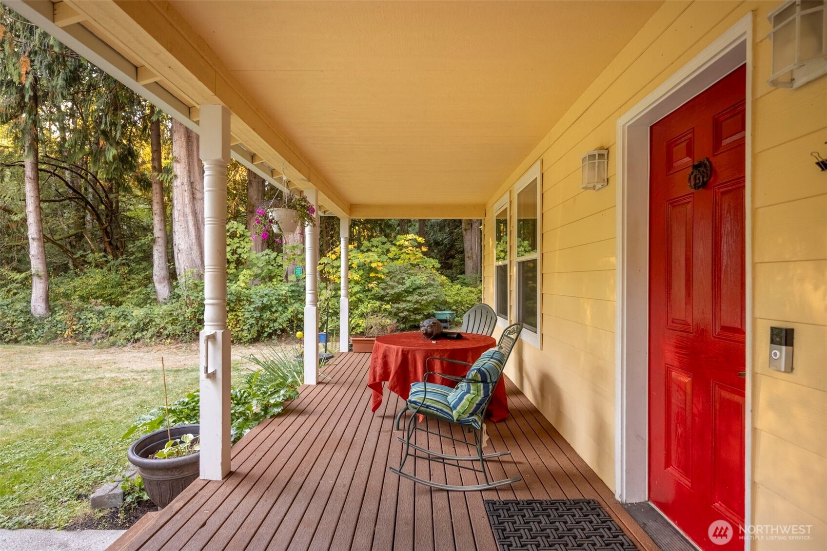 24165 Port Gamble Road Northeast Poulsbo, WA 98370 - Photo 5 of 37 a view of chair in the balcony with wooden floor