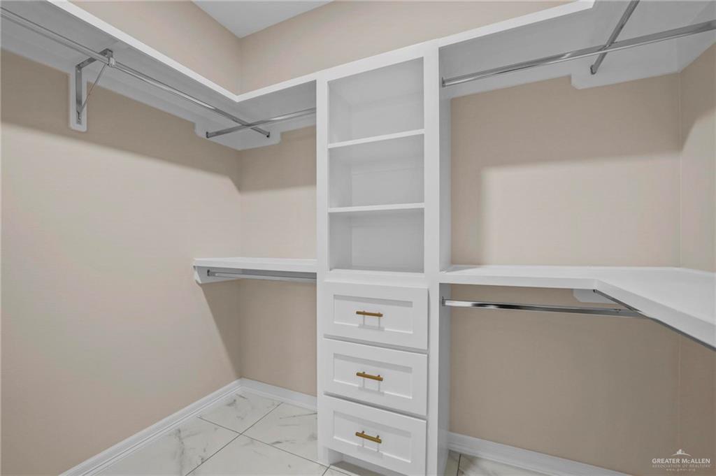 2700 East Conroe Road Edinburg, TX 78542 - Photo 13 of 16 a view of an empty walk in closet
