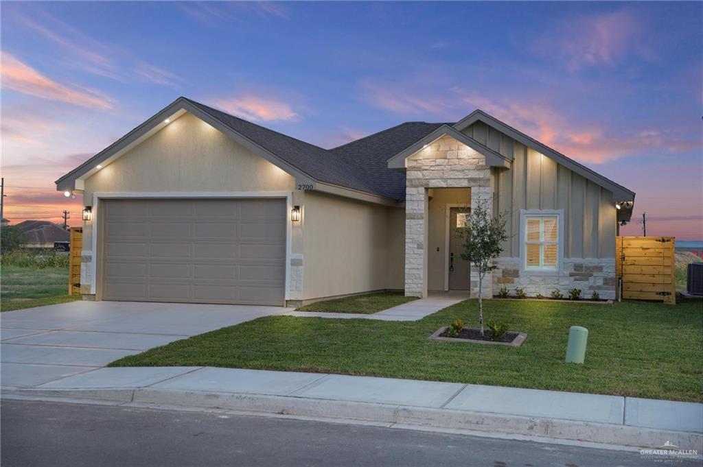 2700 East Conroe Road Edinburg, TX 78542 - Photo 2 of 16 a front view of a house with a yard and garage