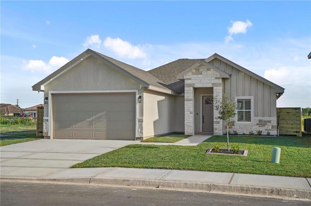 2700 East Conroe Road Edinburg, TX 78542 - Photo 4 of 16 a front view of a house with a yard and garage