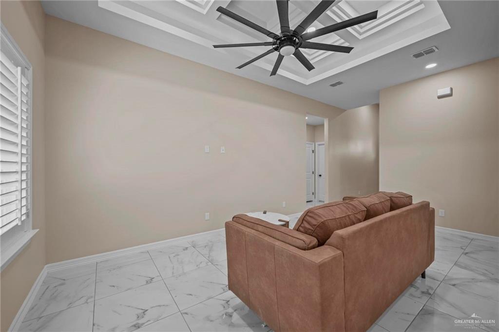 2700 East Conroe Road Edinburg, TX 78542 - Photo 7 of 16 a living room with furniture and a window
