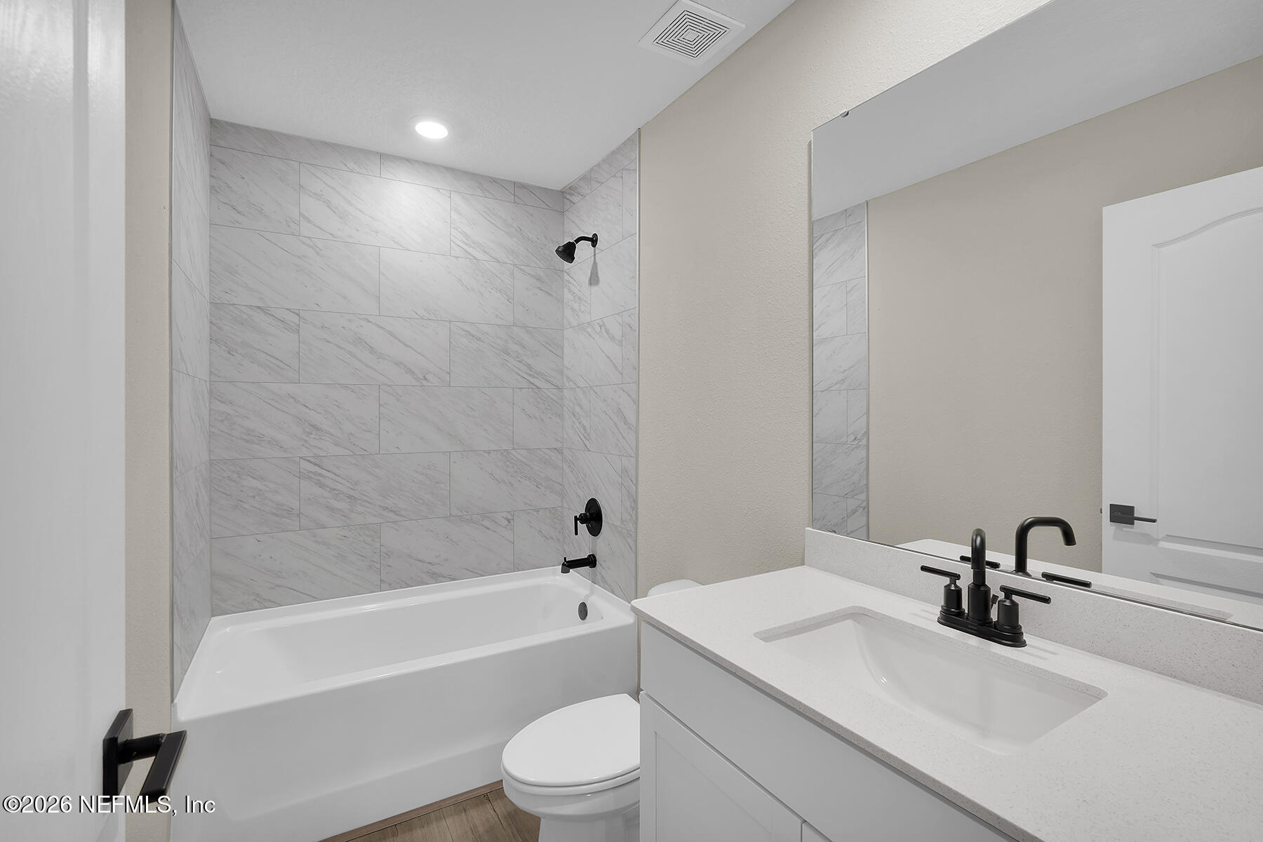 2416 Pemrose Loop Middleburg, FL 32068 - Photo 17 of 26 a bathroom with a sink a toilet and a bathtub