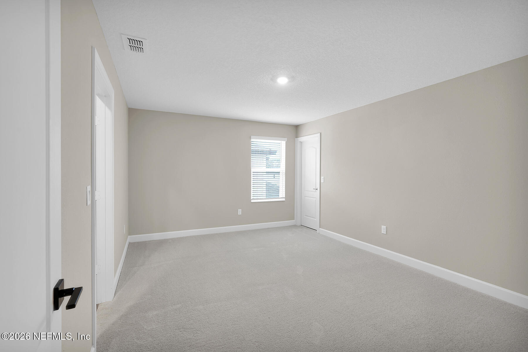 2416 Pemrose Loop Middleburg, FL 32068 - Photo 18 of 26 a view of an empty room with windows