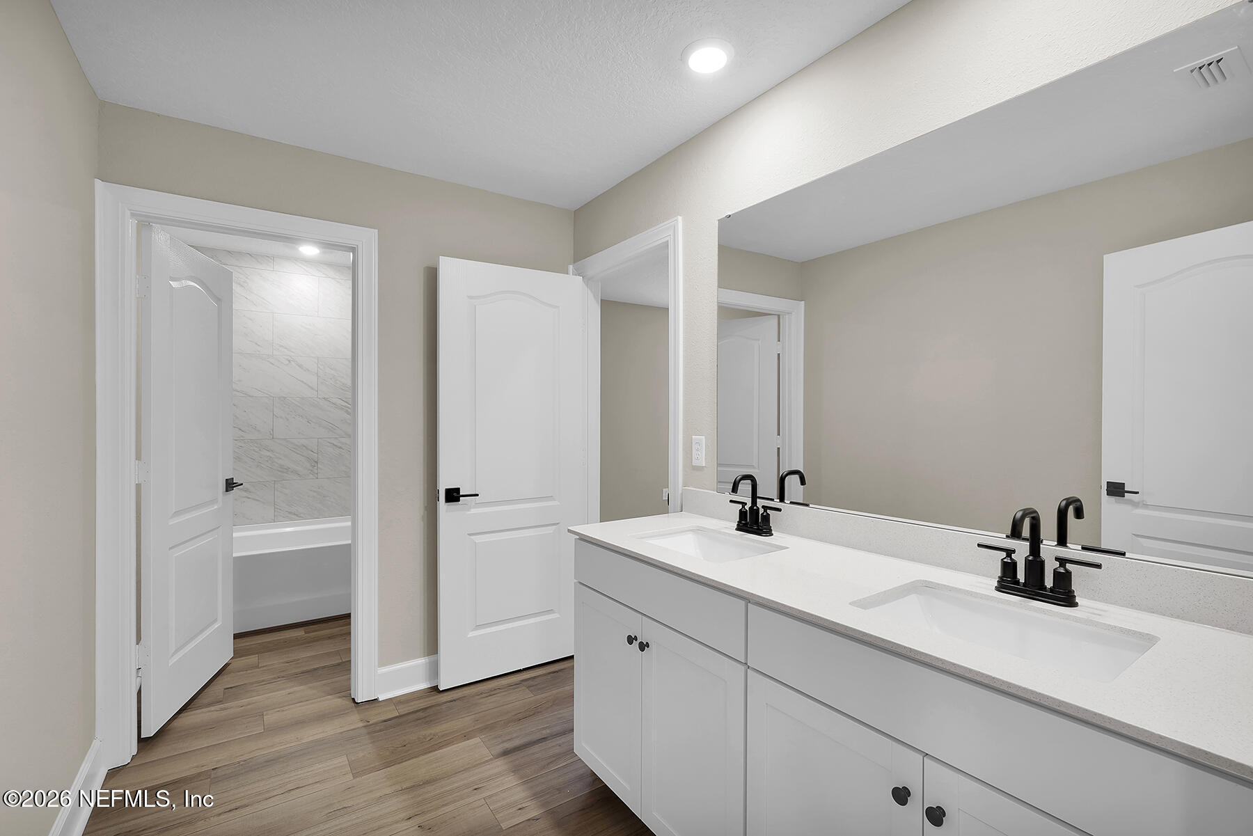 2416 Pemrose Loop Middleburg, FL 32068 - Photo 20 of 26 a bathroom with a double vanity sink mirror and bathtub