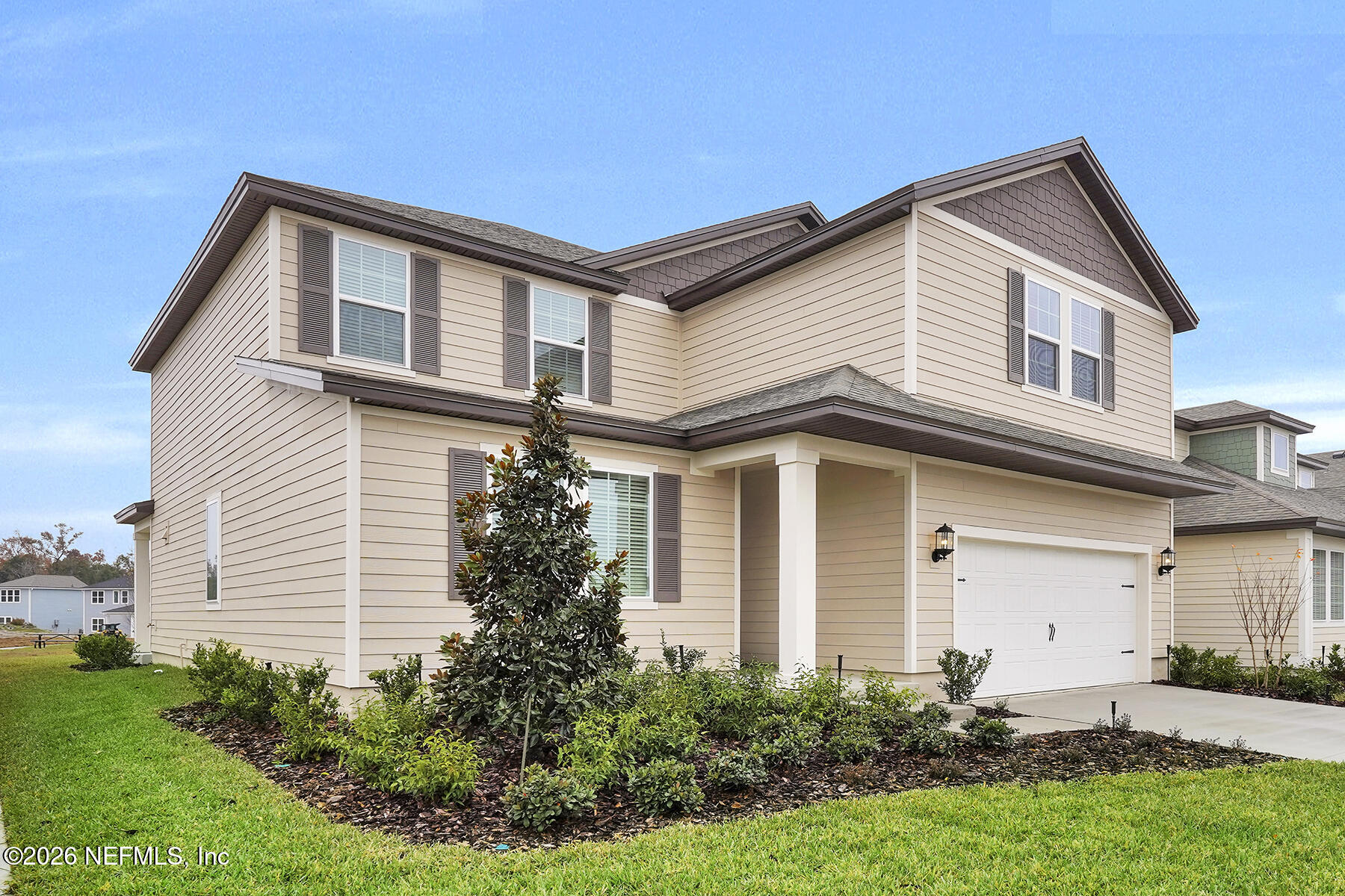 2416 Pemrose Loop Middleburg, FL 32068 - Photo 2 of 26 a front view of a house with a yard