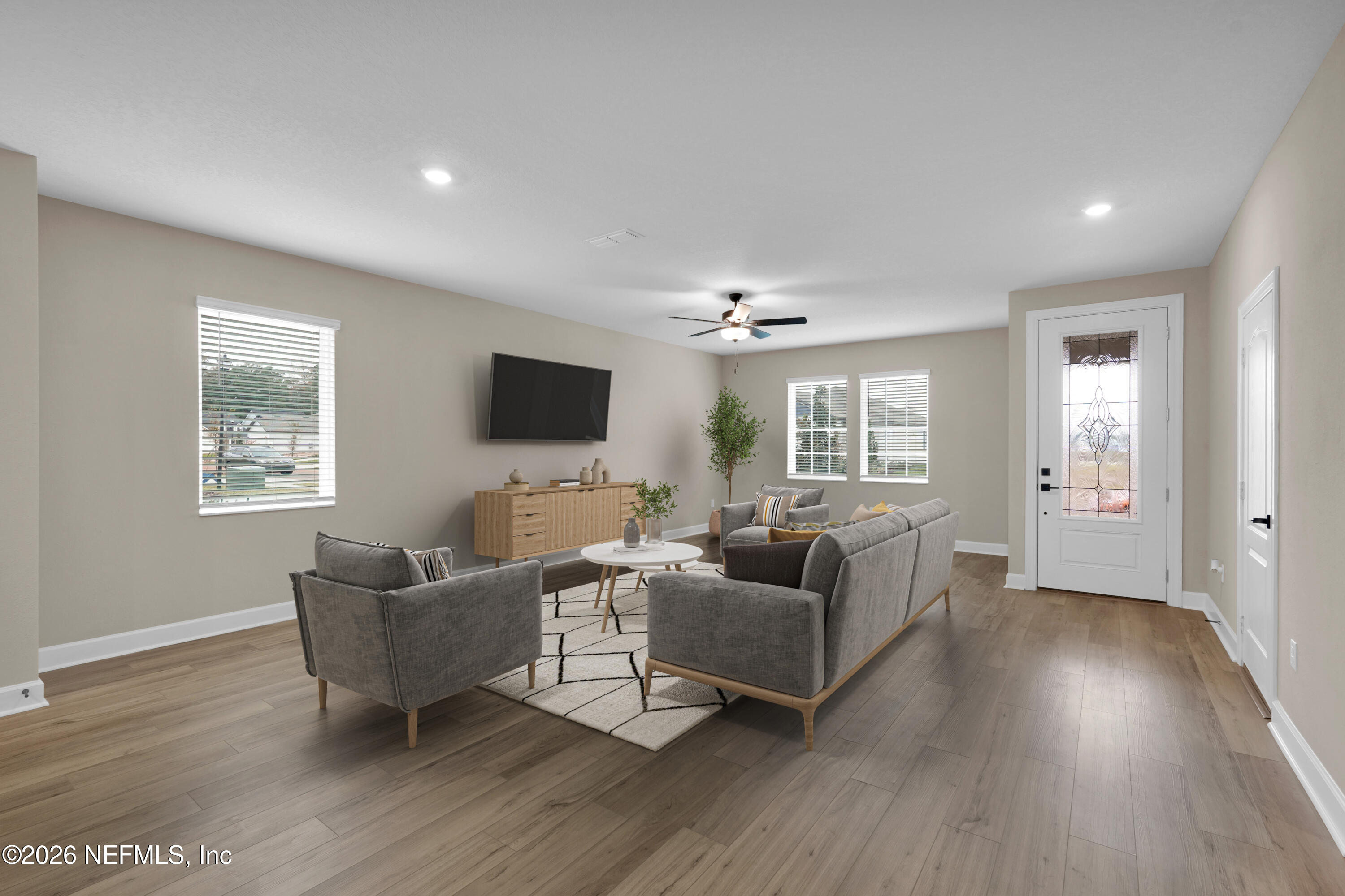 2416 Pemrose Loop Middleburg, FL 32068 - Photo 3 of 26 a living room with furniture and a flat screen tv