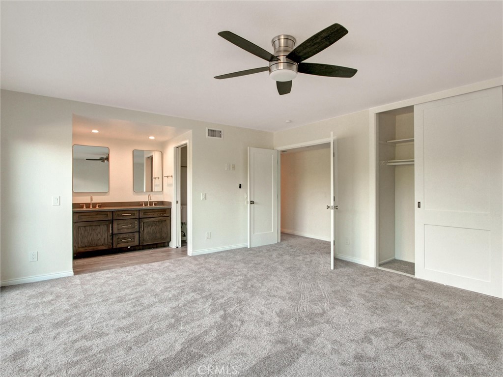 933 Carnation Avenue Costa Mesa, CA 92626 - Photo 12 of 33 a view of a kitchen with a sink and a stove