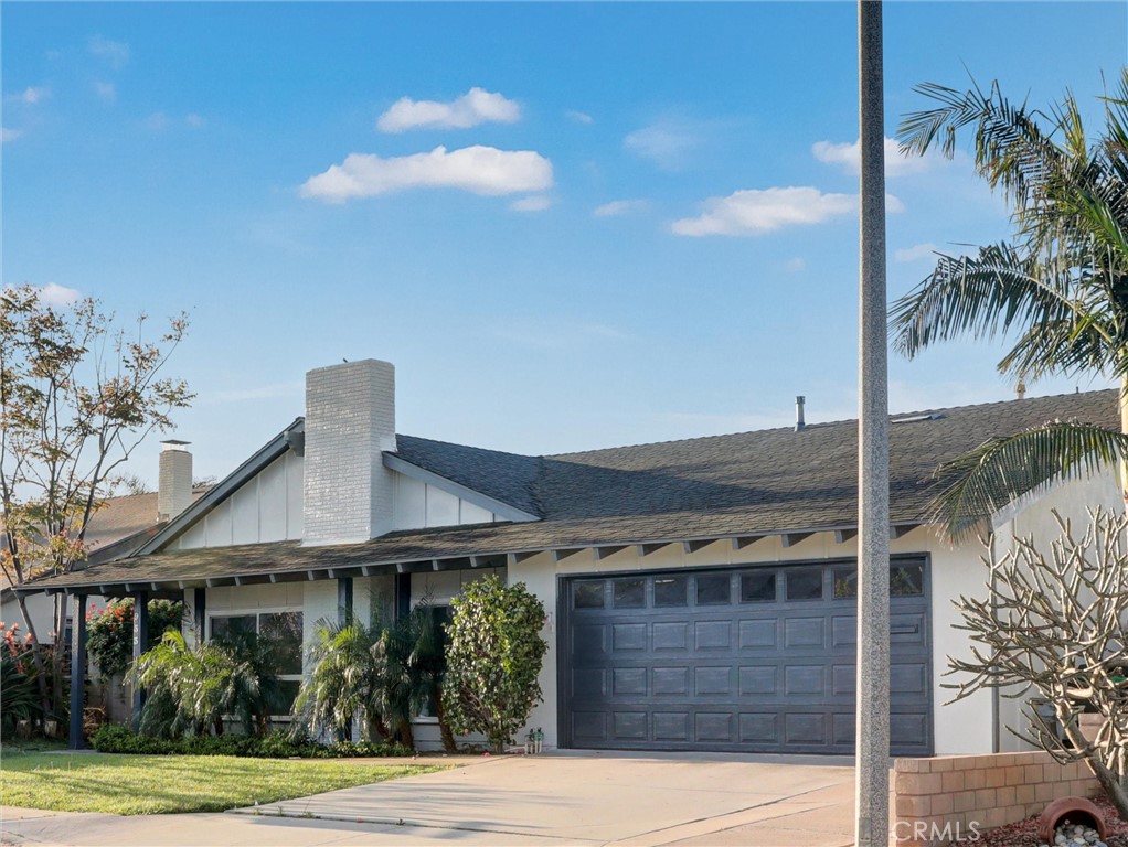 933 Carnation Avenue Costa Mesa, CA 92626 - Photo 2 of 33 a front view of a house with garden