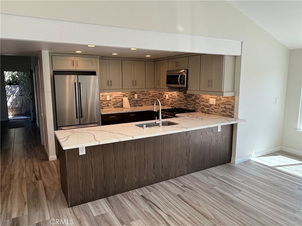 933 Carnation Avenue Costa Mesa, CA 92626 - Photo 23 of 33 a bathroom with a sink and a mirror