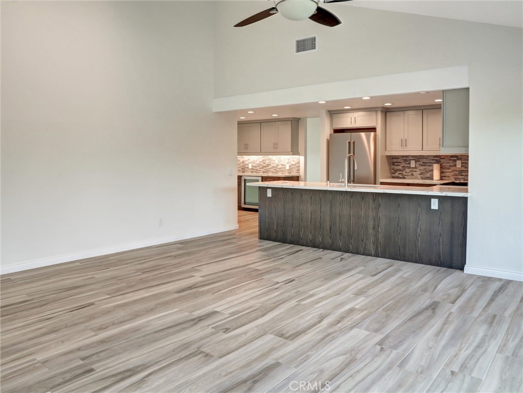 933 Carnation Avenue Costa Mesa, CA 92626 - Photo 26 of 33 a view of kitchen with wooden floor